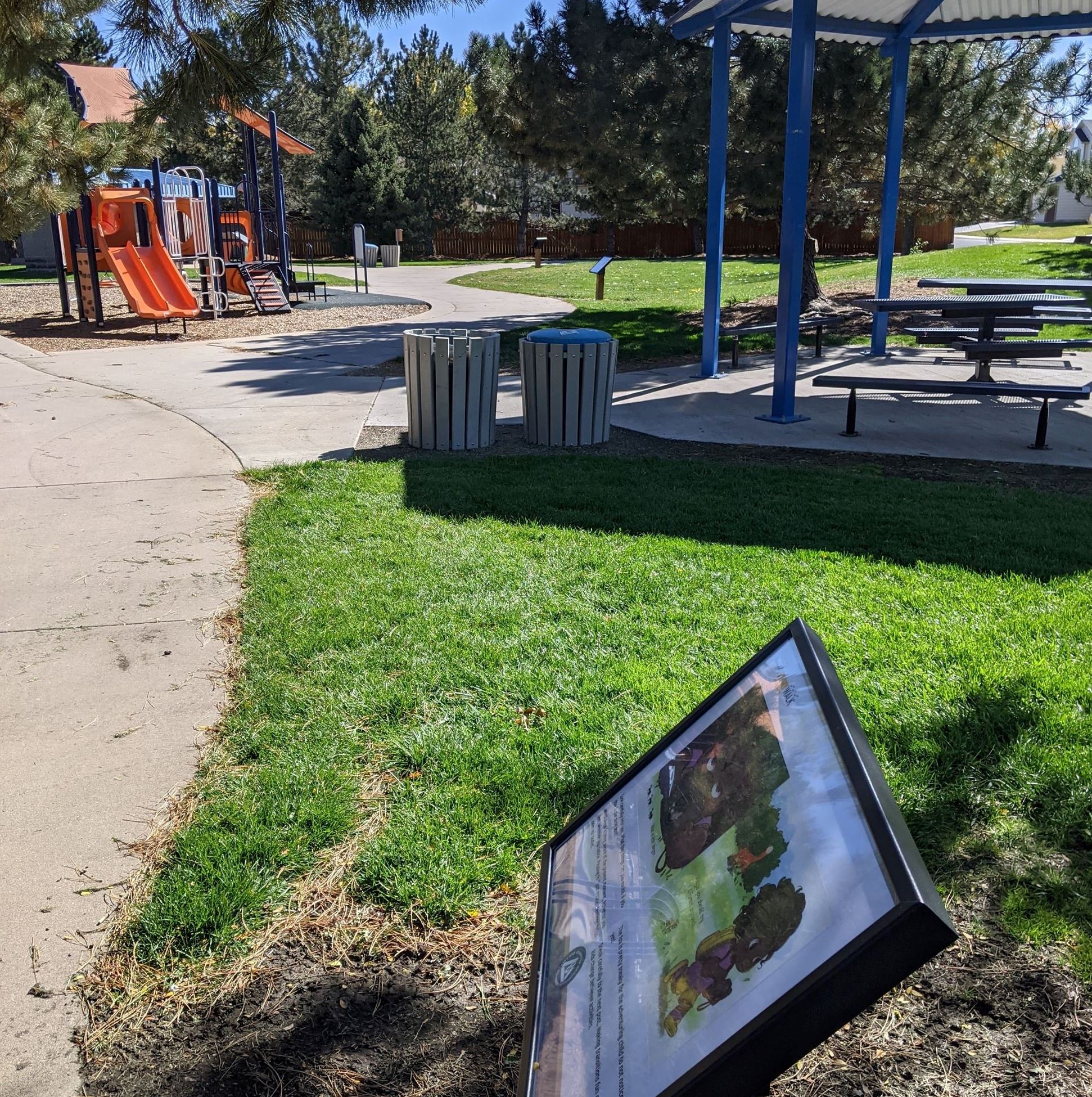 StoryWalk near picnic table and playground at Bronco Park